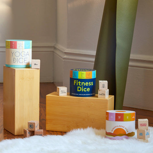 Mindfulness Dice set displayed on a soft white rug.