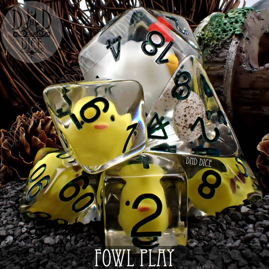 Fowl Play 8 Dice Set: eight translucent resin dice with yellow chick figures inside and black numbers.