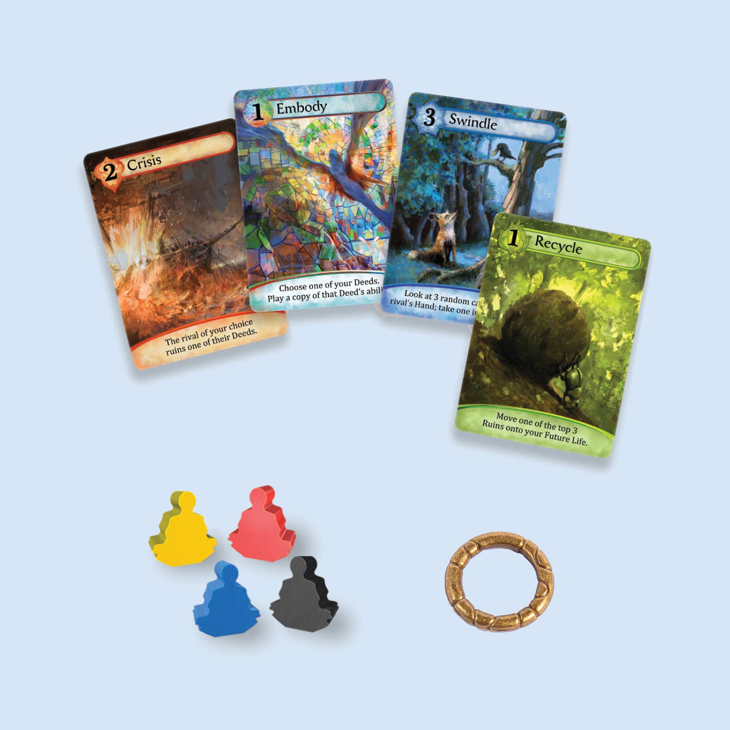 Karmaka game components: four cards, player tokens, and a ring.
