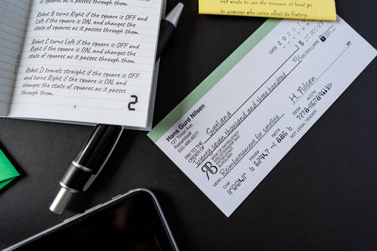 A check, notebook page, pen, sticky note & phone—Family Secrets Series: Episode 11 - Perilous Choices treasure.