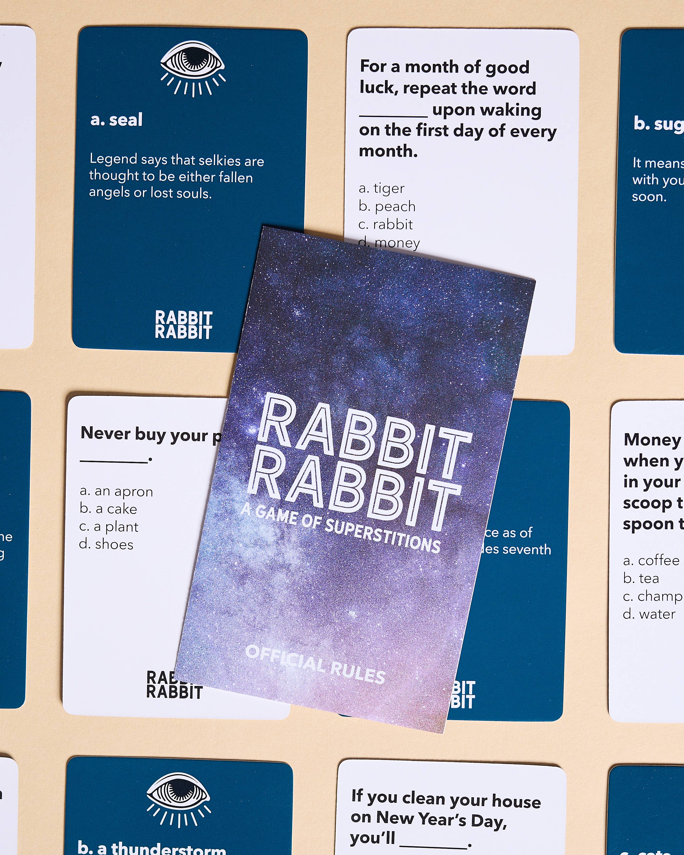 Rabbit Rabbit: A Game of Superstitions card game with folklore-inspired cards.