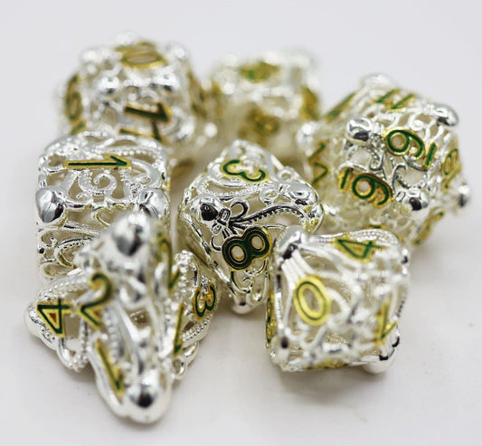 Celestial Mind Eater Hollow RPG Dice Set, silver and gold metal dice with detailed filigree on a white background.