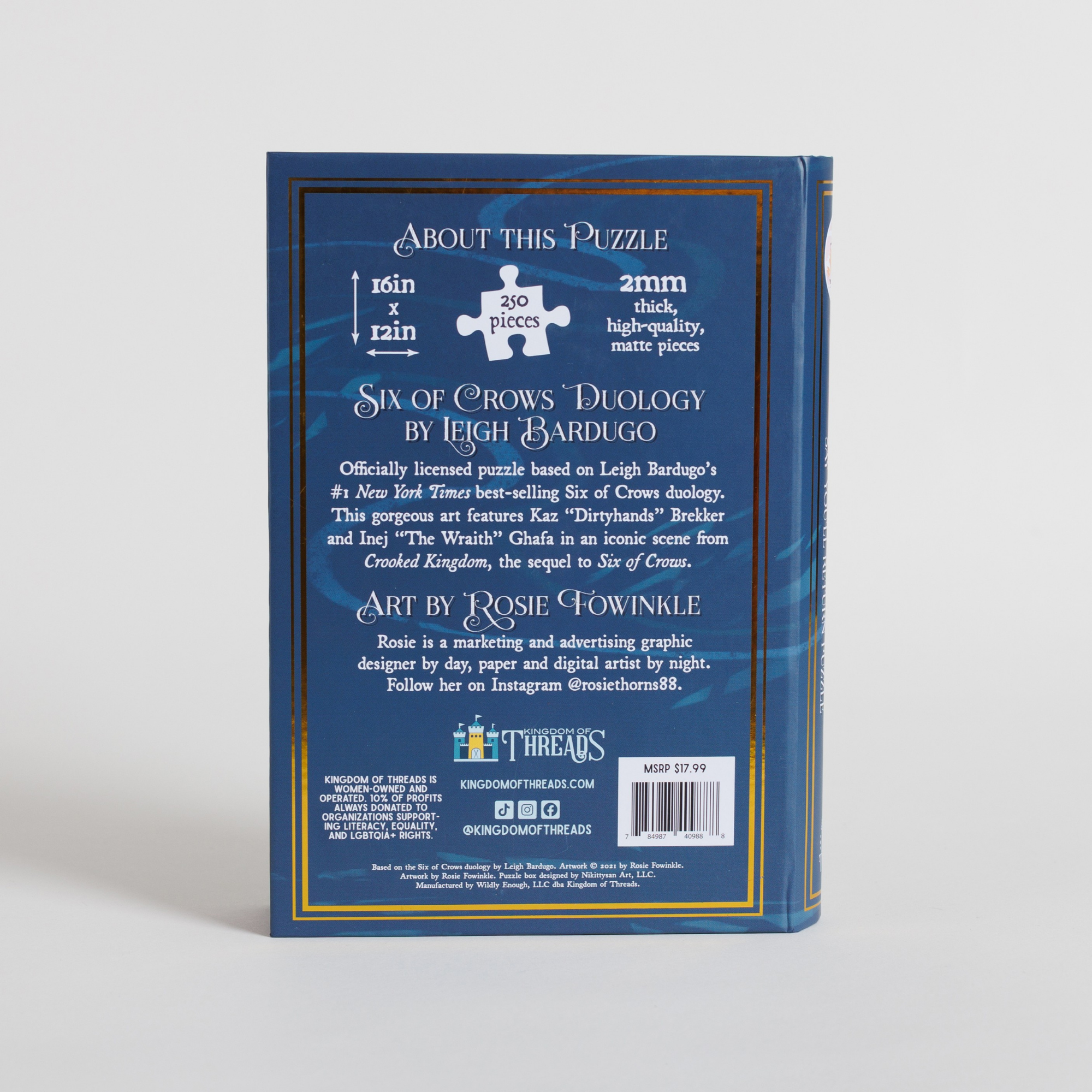 Six of Crows Duology 250-piece puzzle by Leigh Bardugo, art by Rosie Fowinkle, in book-shaped keepsake box.