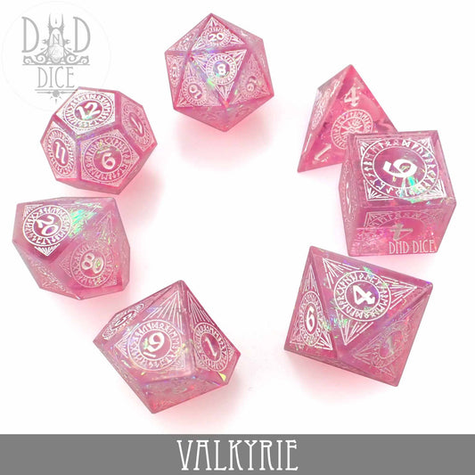 Valkyrie Handmade 7-piece pink sparkly resin dice set with white numbers.