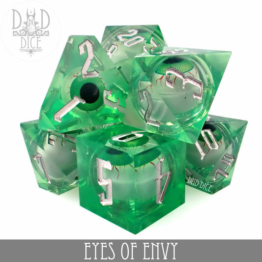 Eyes of Envy - Liquid Core set of 7 green resin dice with silver numbers and a realistic green eyeball inside each die.