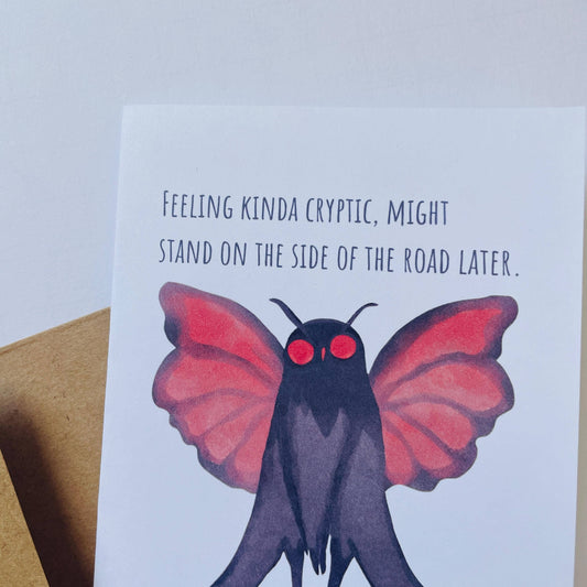 Mothman Cryptic Humor Card with a red-eyed moth and the text: Feeling kinda cryptic, might stand by the road.