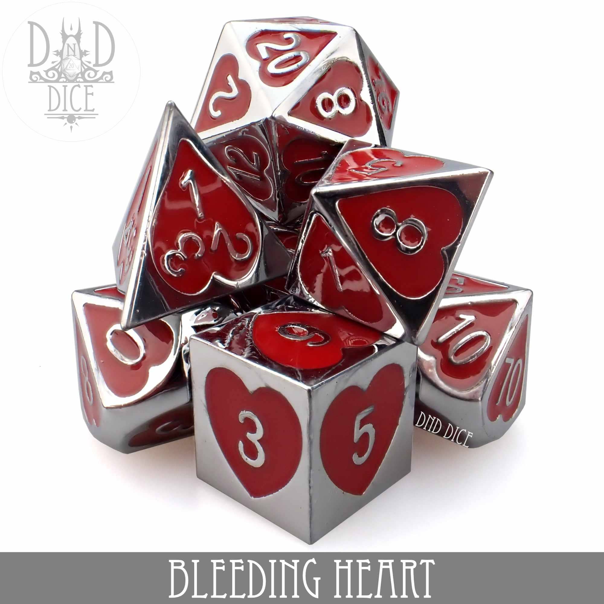 Bleeding Heart metal dice set: 7 silver-rimmed zinc alloy polyhedral dice with red heart faces and white numbering.