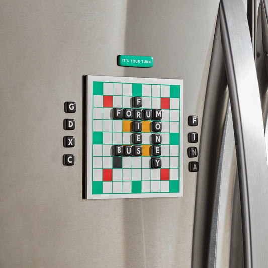 Scrumble Magnetic Fridge Game with magnetic tiles spelling FORUM, BUSY, MONEY, FINAL, and ITS YOUR TURN.