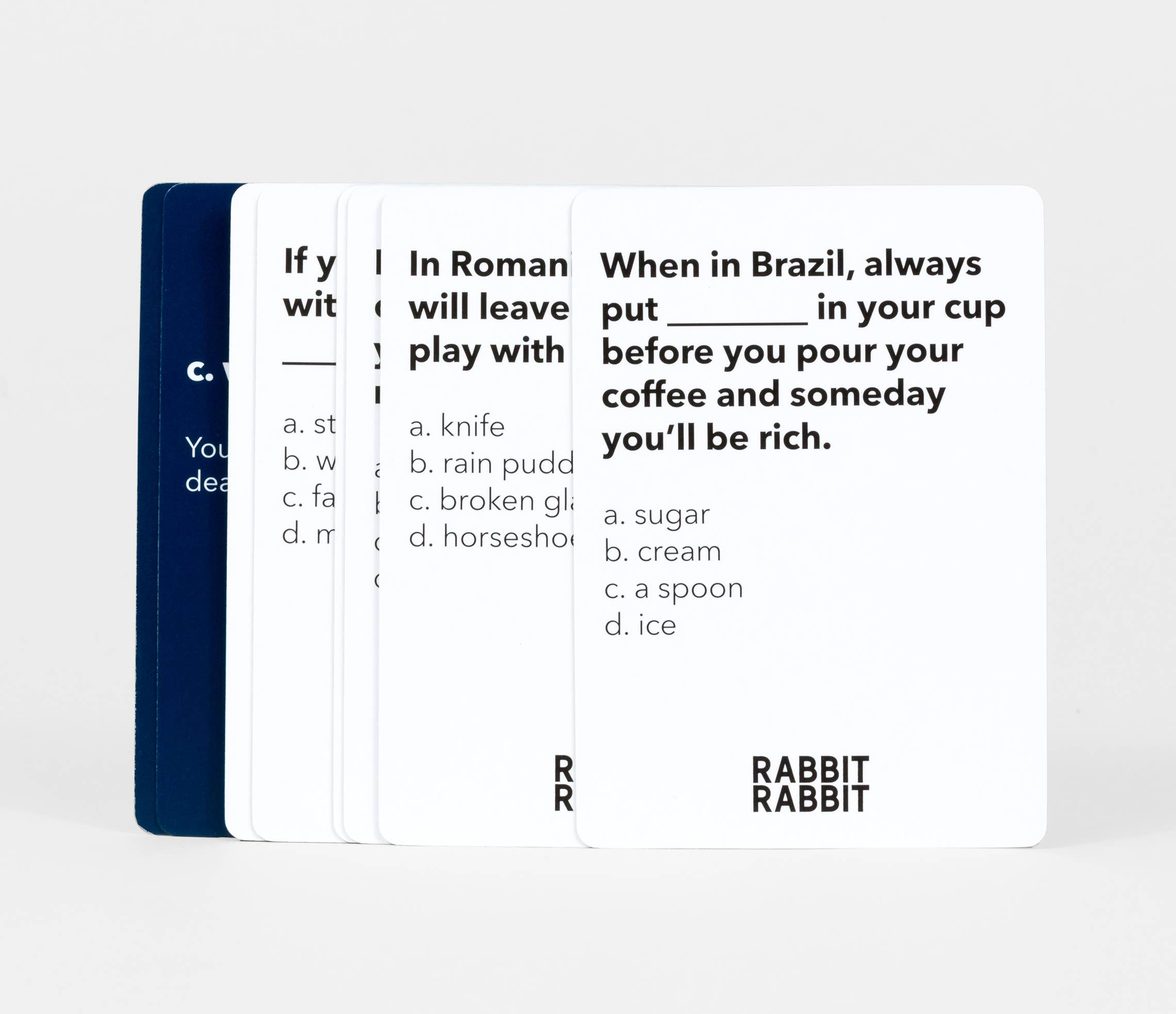 Rabbit Rabbit game cards, front card presents a rabbit superstitions question with four answer choices.