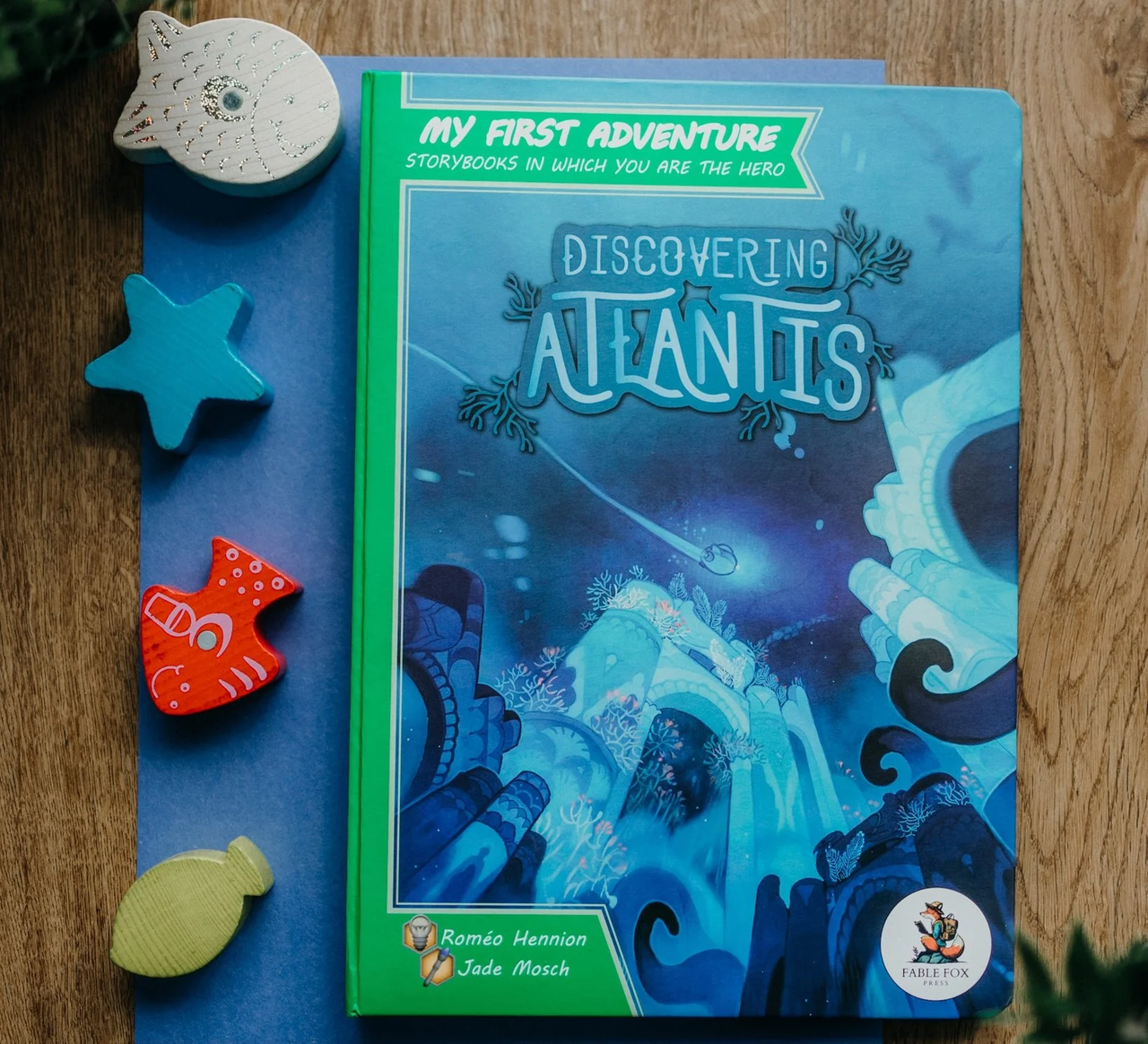My First Adventure: Discovering Atlantis storybook with wooden sea creatures.