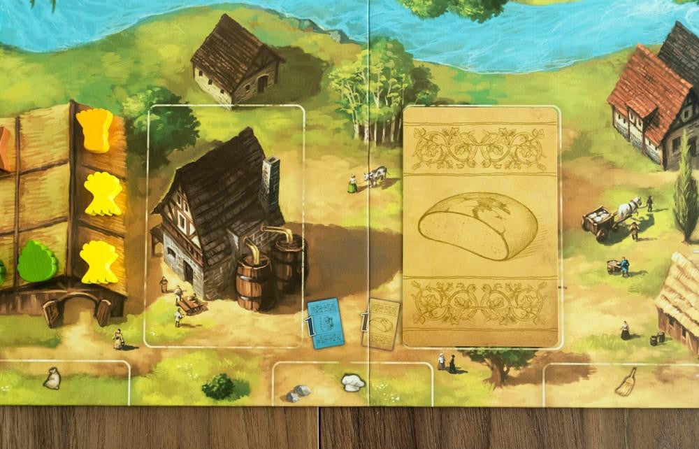 Beer & Bread board game with wooden houses, game pieces, and resource management elements.