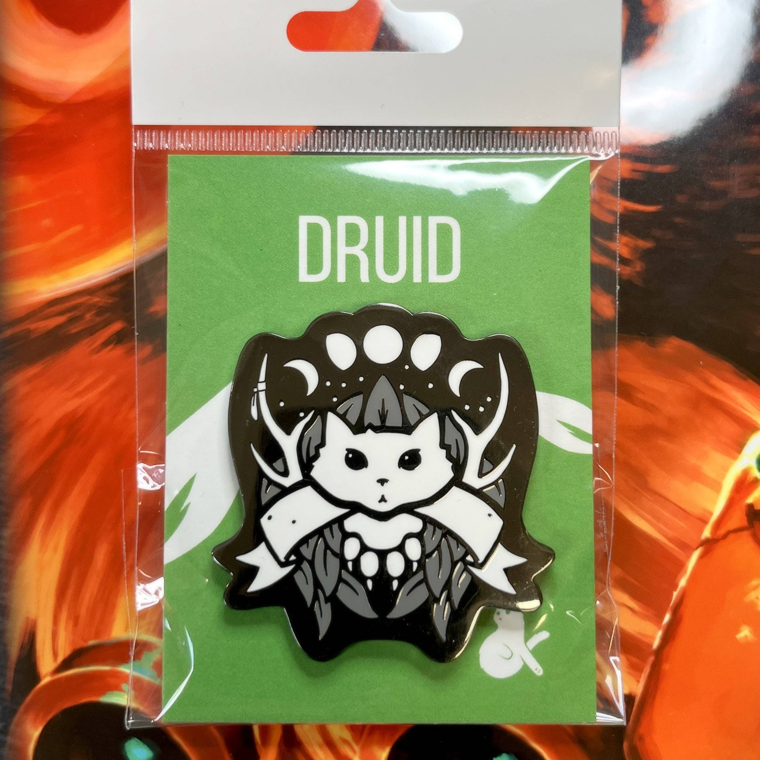 Druid enamel pin featuring a black and white cat druid with antlers and black nickel plating.