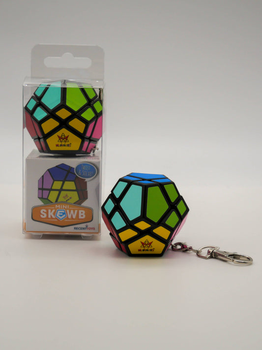 Mefferts Keychain colorful geometric puzzle next to clear packaging labeled Mini Skewb.