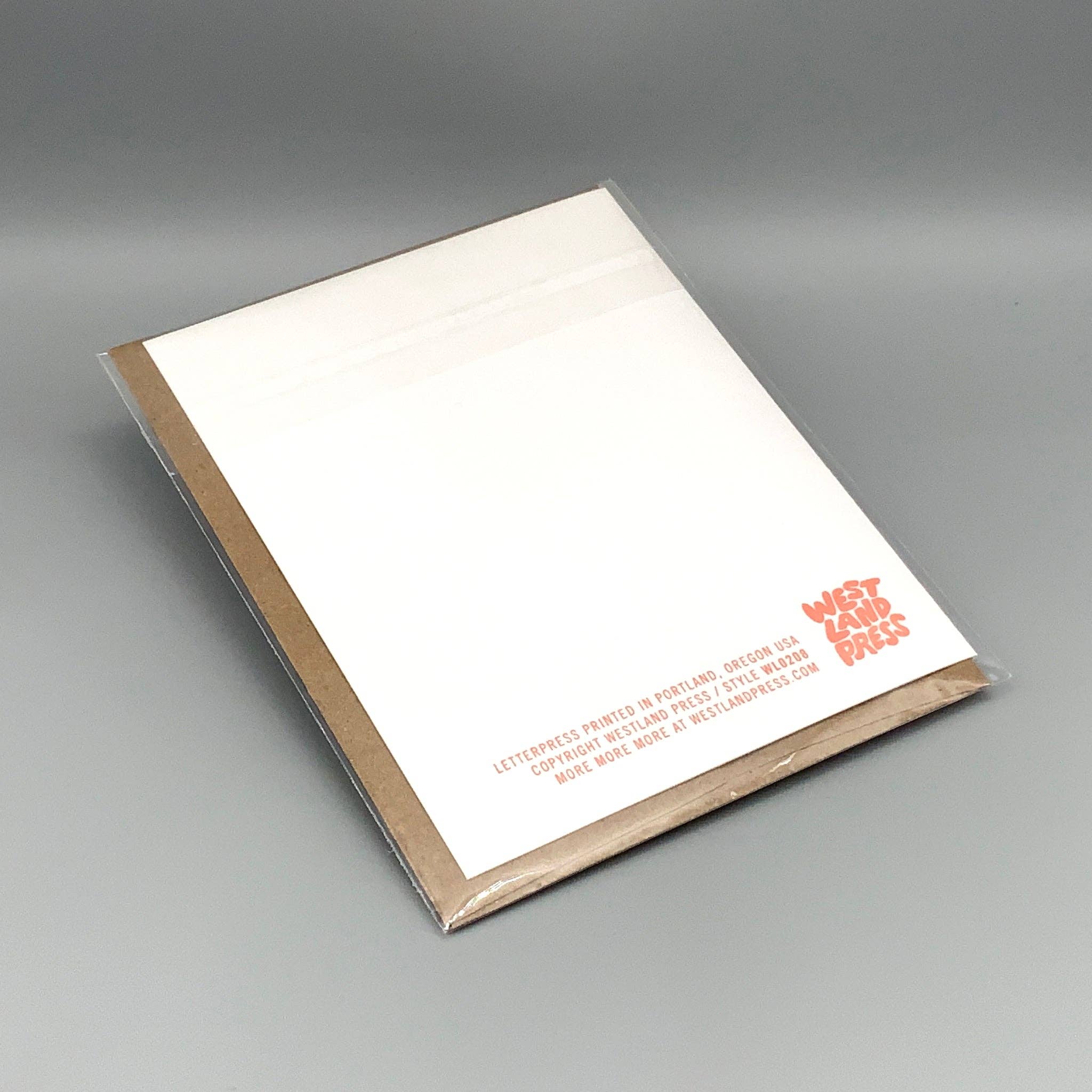 Eye For You white letterpress note card with orange text and brown envelope, made in Portland, Oregon.