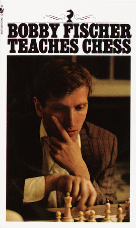 Bobby Fischer Teaches Chess book with a man in a suit studying a chessboard on the cover.