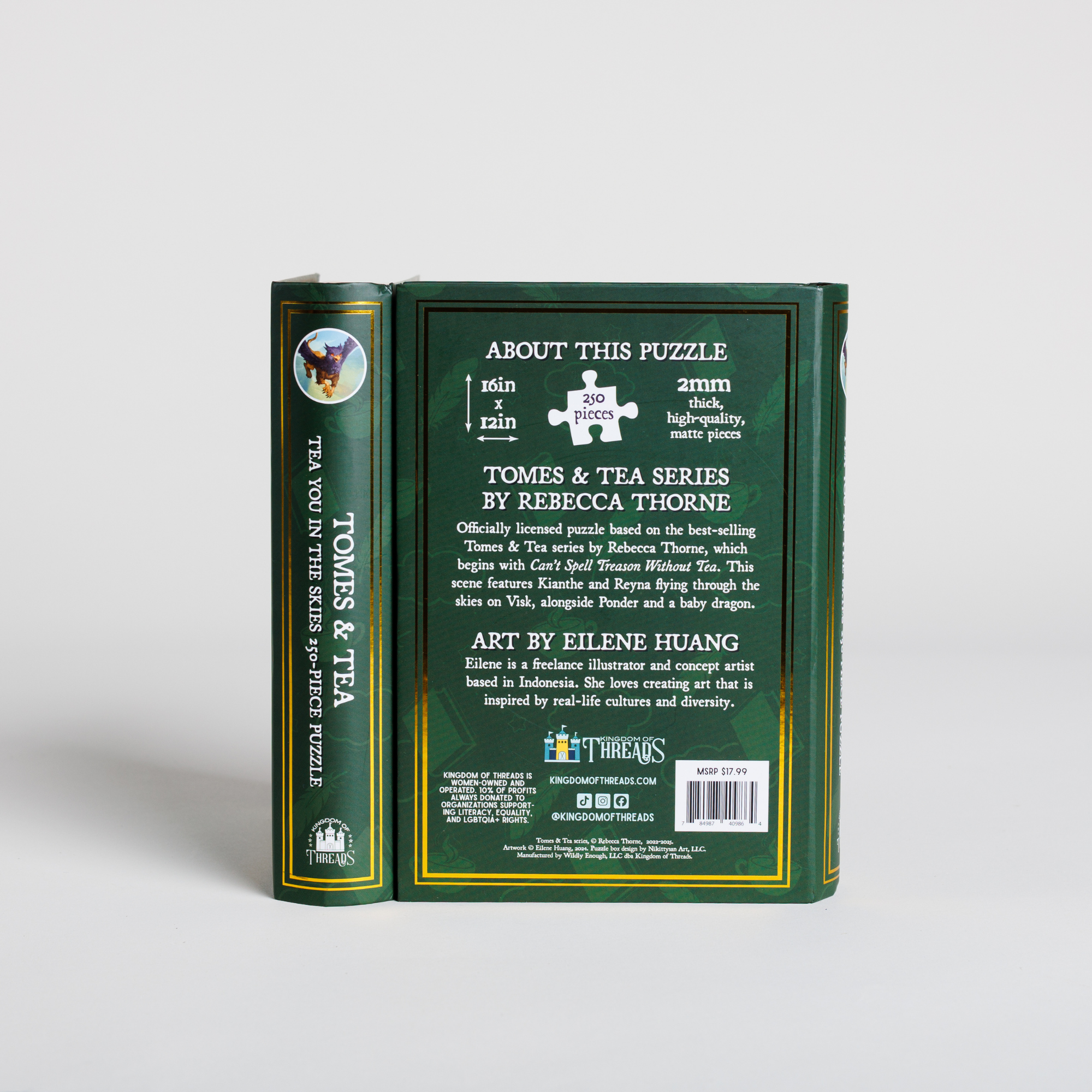 Green book-shaped keepsake box for Tea You in the Skies Puzzle by Tomes & Tea, puzzle details on back cover.