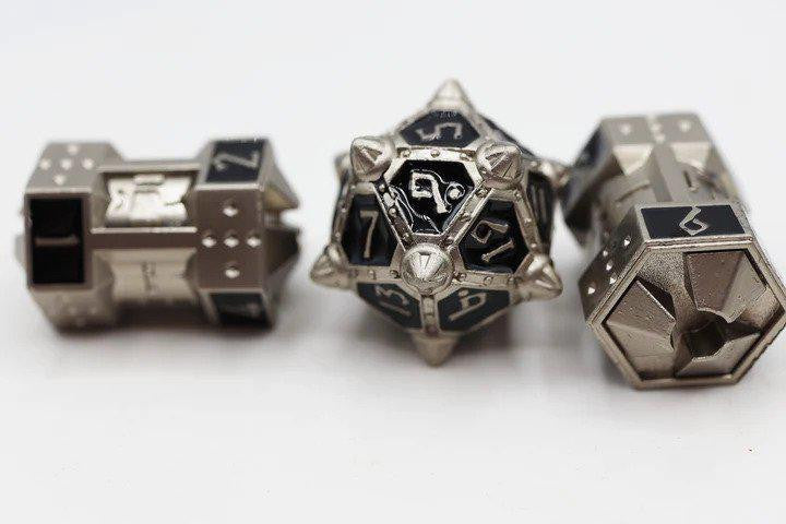 The Dice 51: Onyx Ethers CCG Metal Dice Set with three UFO-themed metal dice and geometric numbers.