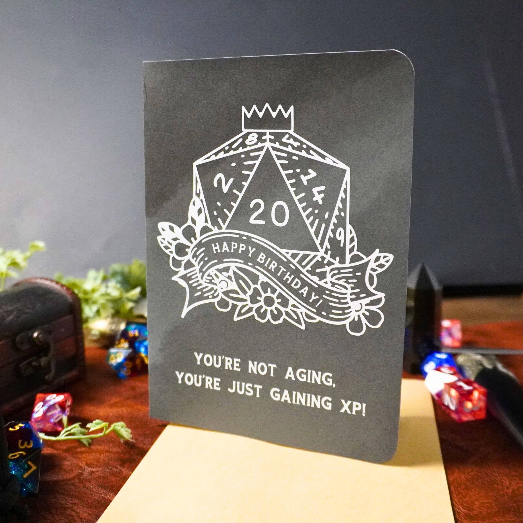 Youre Not Aging XP DnD Birthday Card with D20 and You’re not aging, you’re just gaining XP text.