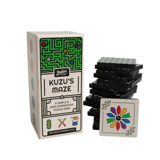 Kuzus Maze puzzle game with stacked black tiles and a floral tile. Semi-cooperative travel game.