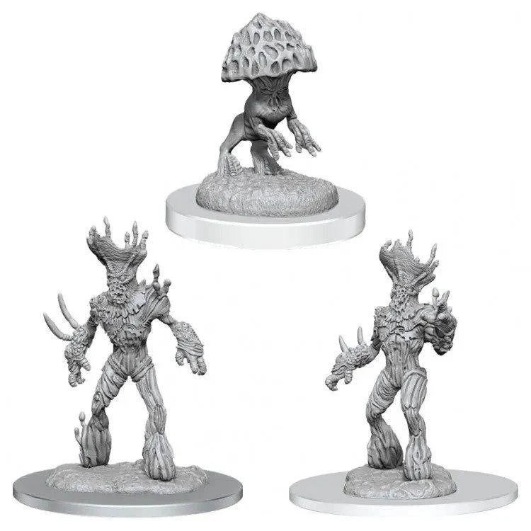 Three unpainted D&D Myconid Sovereign and Sprouts miniatures on round bases.