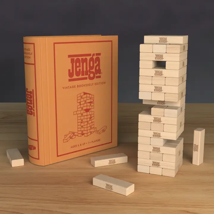 Jenga Vintage Bookshelf Edition and a hardwood block tower on a wooden table.