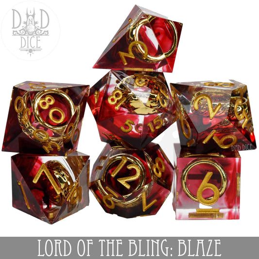 Lord of the Bling: Blaze variant red resin DND dice set with gold numbers and rings, stacked.