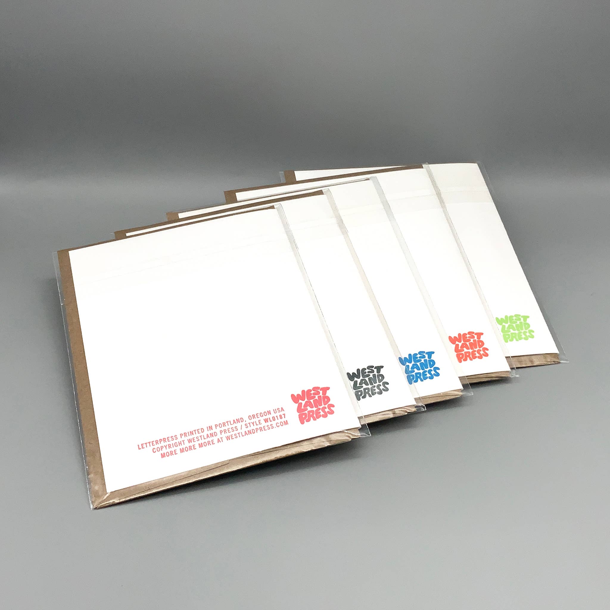 Five packs of Purrfect Birthday letterpress cards with West Clay Press logos and recycled kraft envelopes.