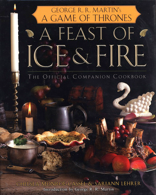 A Feast of Ice and Fire Game of Thrones cookbook featuring medieval recipes and a swan-shaped dish on the cover.