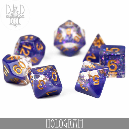 Hologram polyhedral dice set in blue and clear resin with gold numbers.