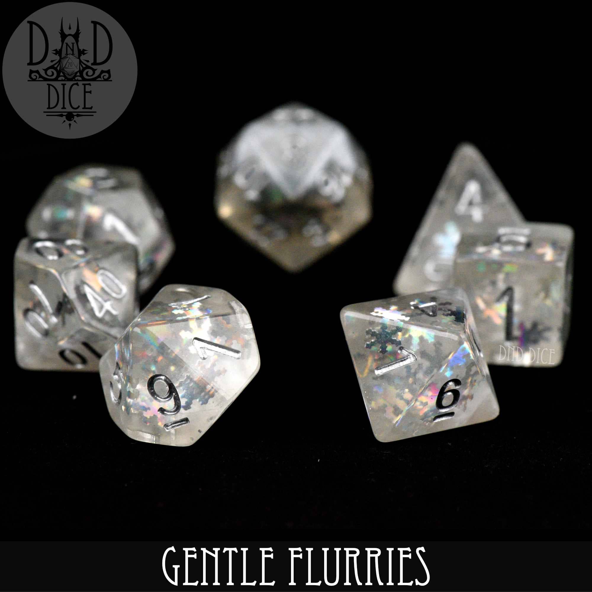 Gentle Flurries by DnD Dice: Set of seven translucent resin polyhedral dice with black numbers and silver sparkles.
