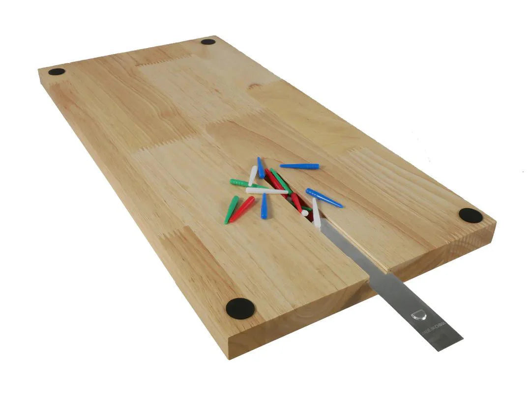 Rectangular oak 4-track wood cribbage board with peg slots and a partially inserted metal tool.