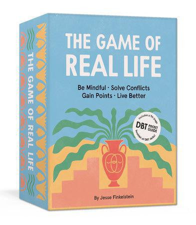 The Game of Real Life board game box with Be Mindful. Solve Conflicts. Gain Points. Live Better. text.