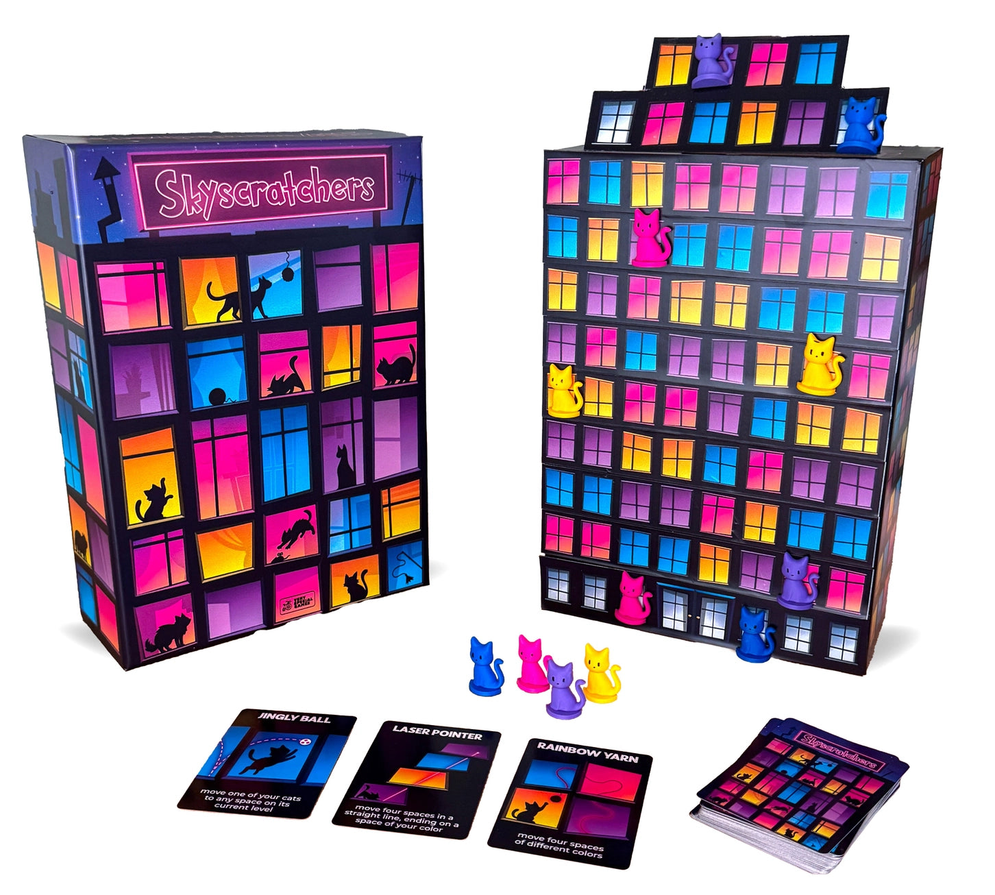 Skyscratchers board game with cat figures and cards featuring cats climbing a building.