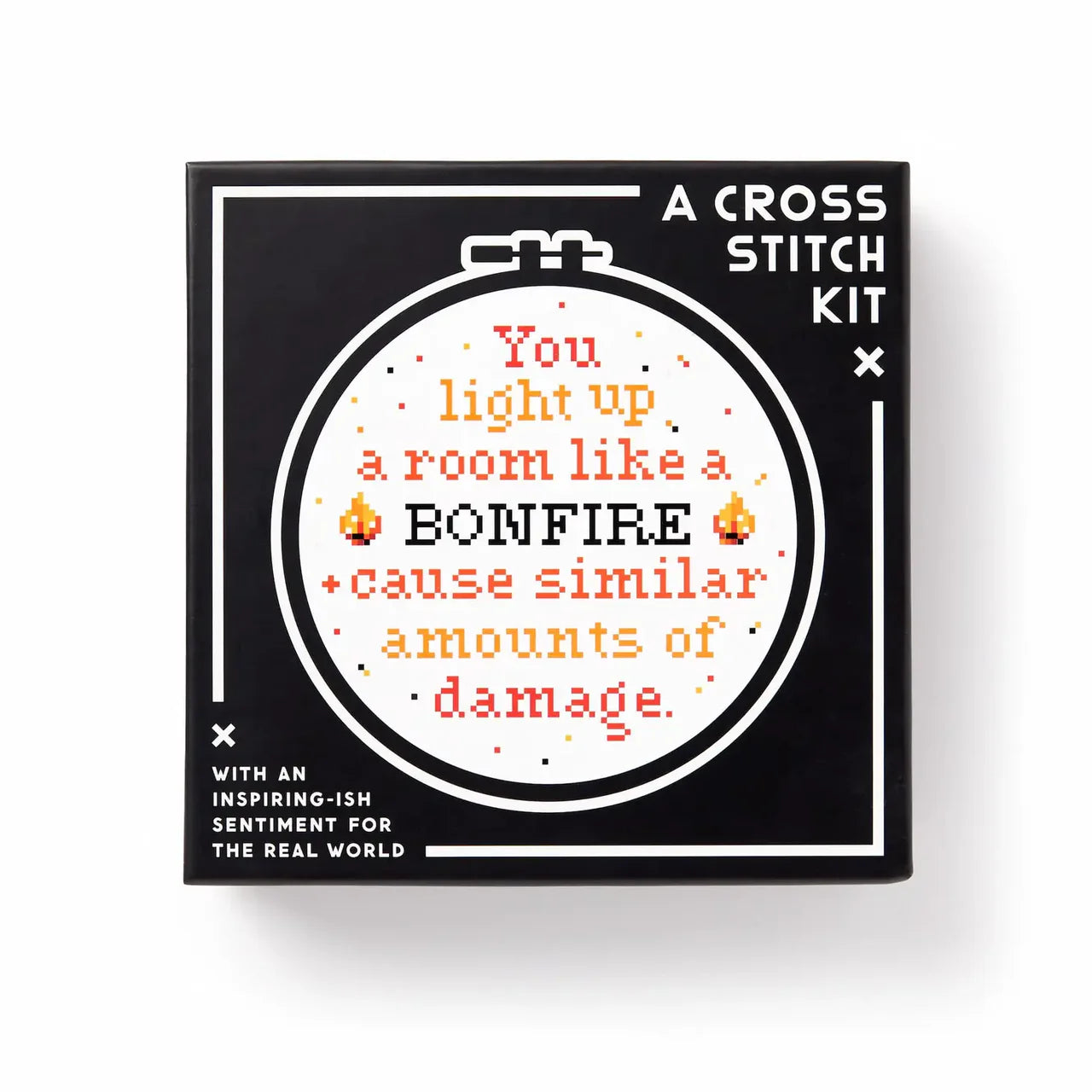 You Light Up A Room Cross Stitch Kit with box showing the phrase, You light up a room like a BONFIRE.