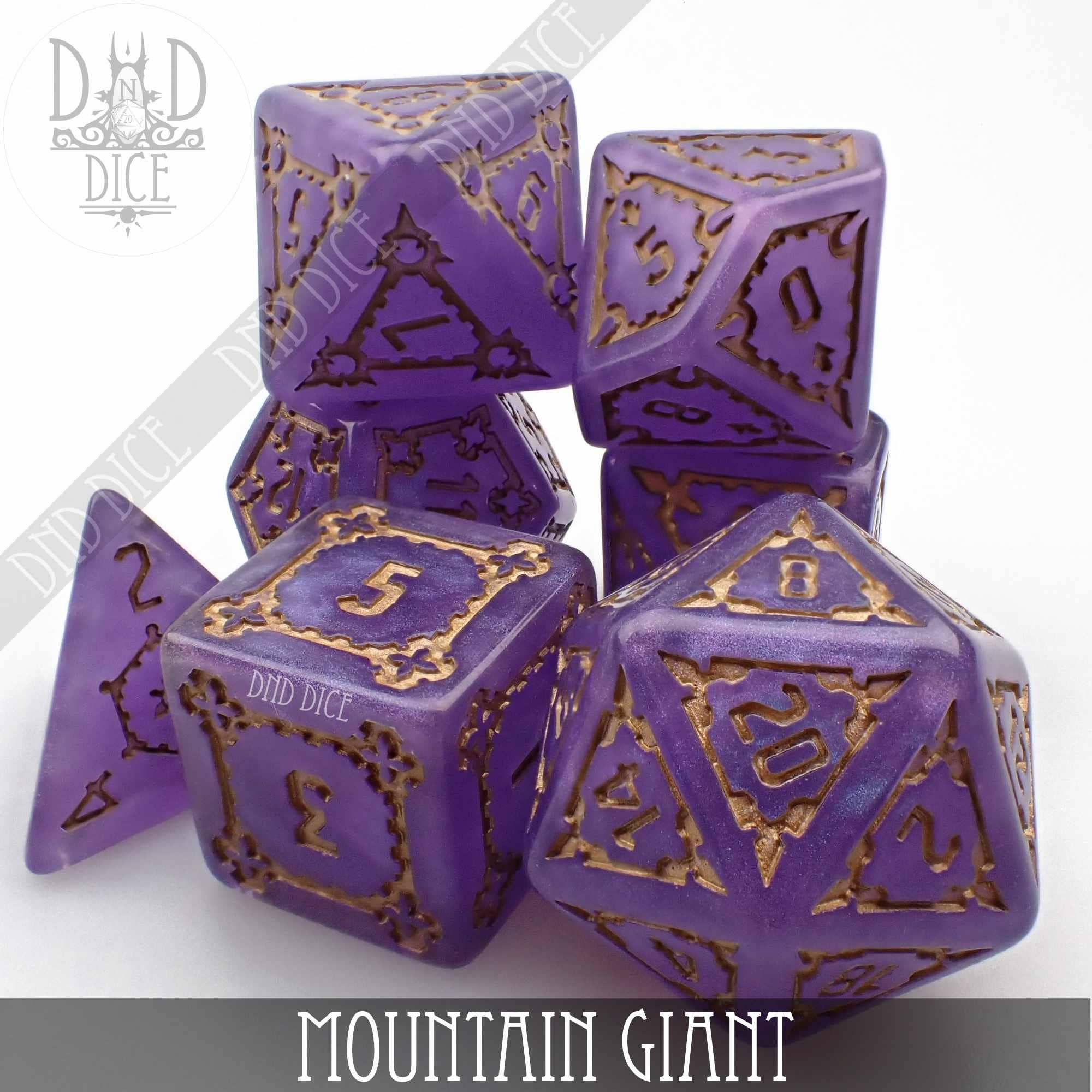 Purple resin 7-piece polyhedral dice set with gold numbers, Mountain Giant (Oversize), in a plastic box.