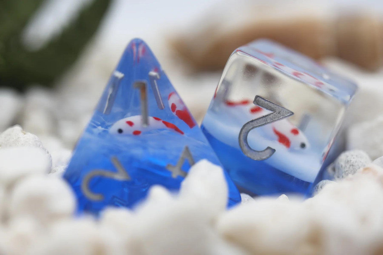 Koi Pond RPG Dice Set with blue resin dice featuring small koi fish inside.