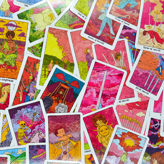 Cosmic Slumber Tarot Deck cards displayed, showing sword and cup suits with colorful illustrated designs.