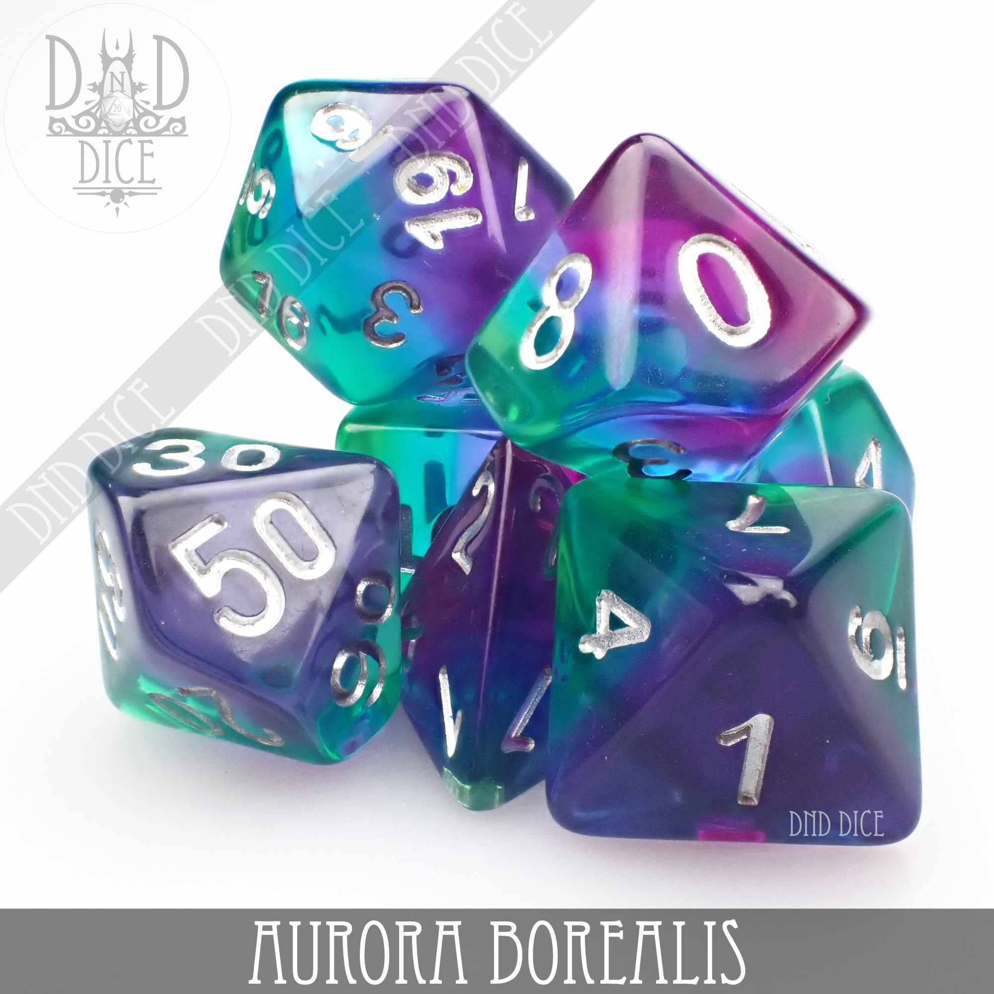 Seven translucent resin dice in blue, purple, and green hues, Aurora Borealis variant.