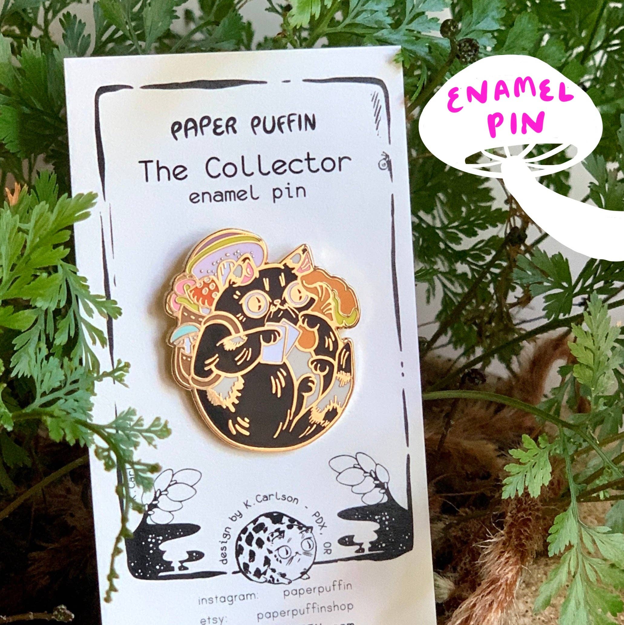 Collector Mushroom Cat enamel pin featuring a black cat holding a mushroom.