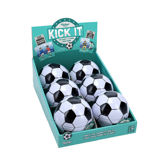 Kick It card game display box with six black and white soccer balls and product packaging.