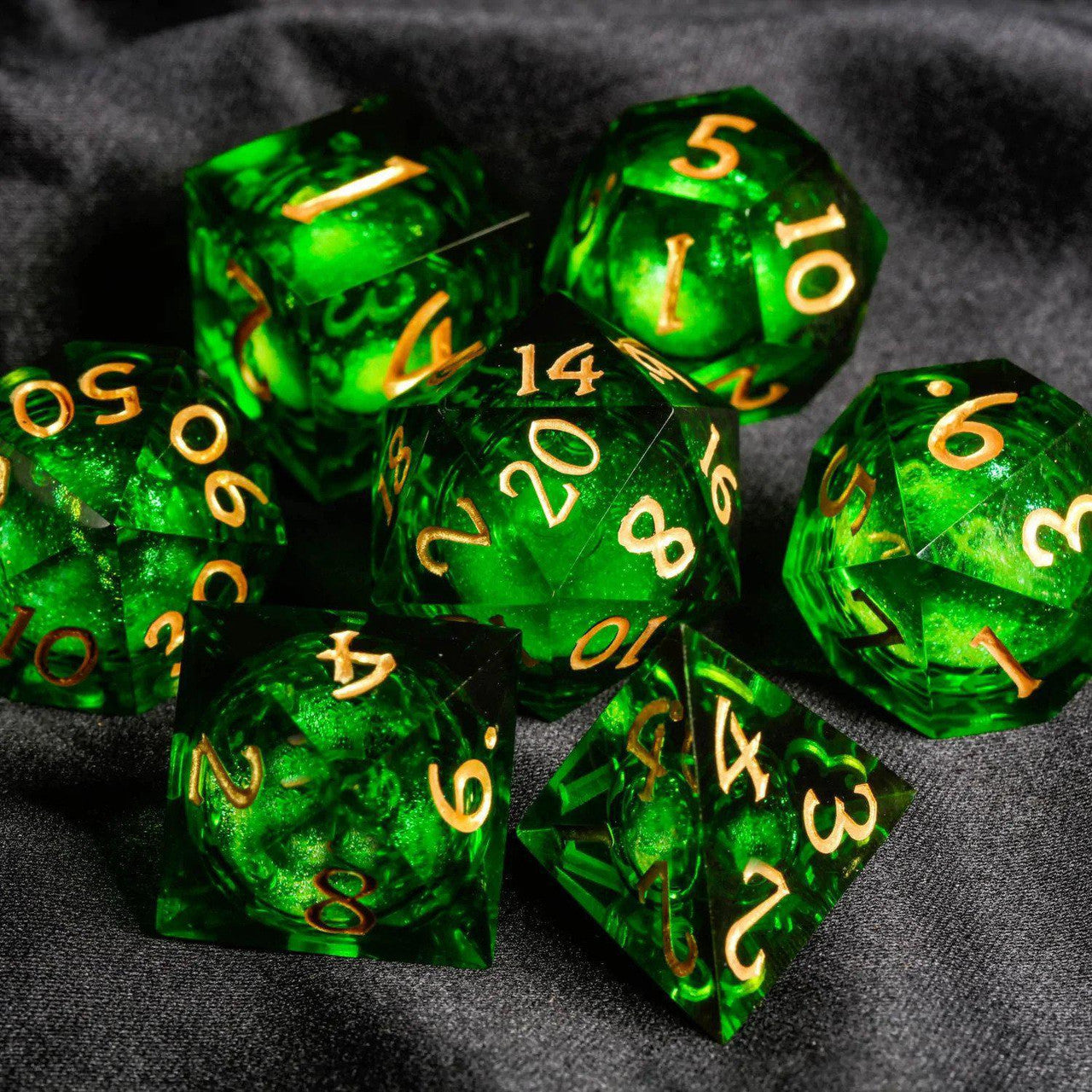 Green Liquid Core Sharp Edge Resin RPG dice set with gold numbers.