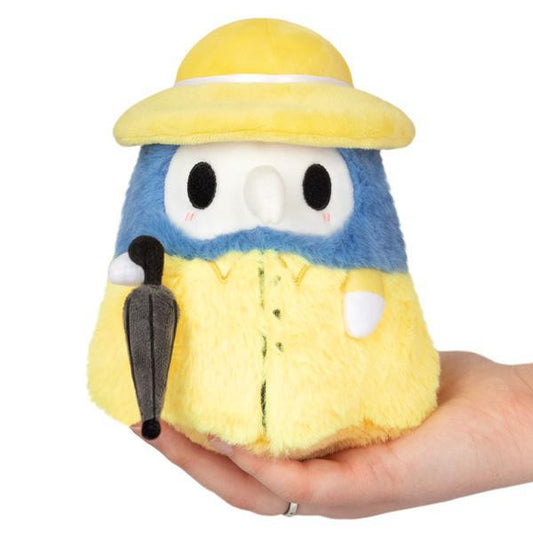 Alter Ego Plague Doctor Rainy Snacker plush in yellow raincoat and hat, holding a black umbrella.