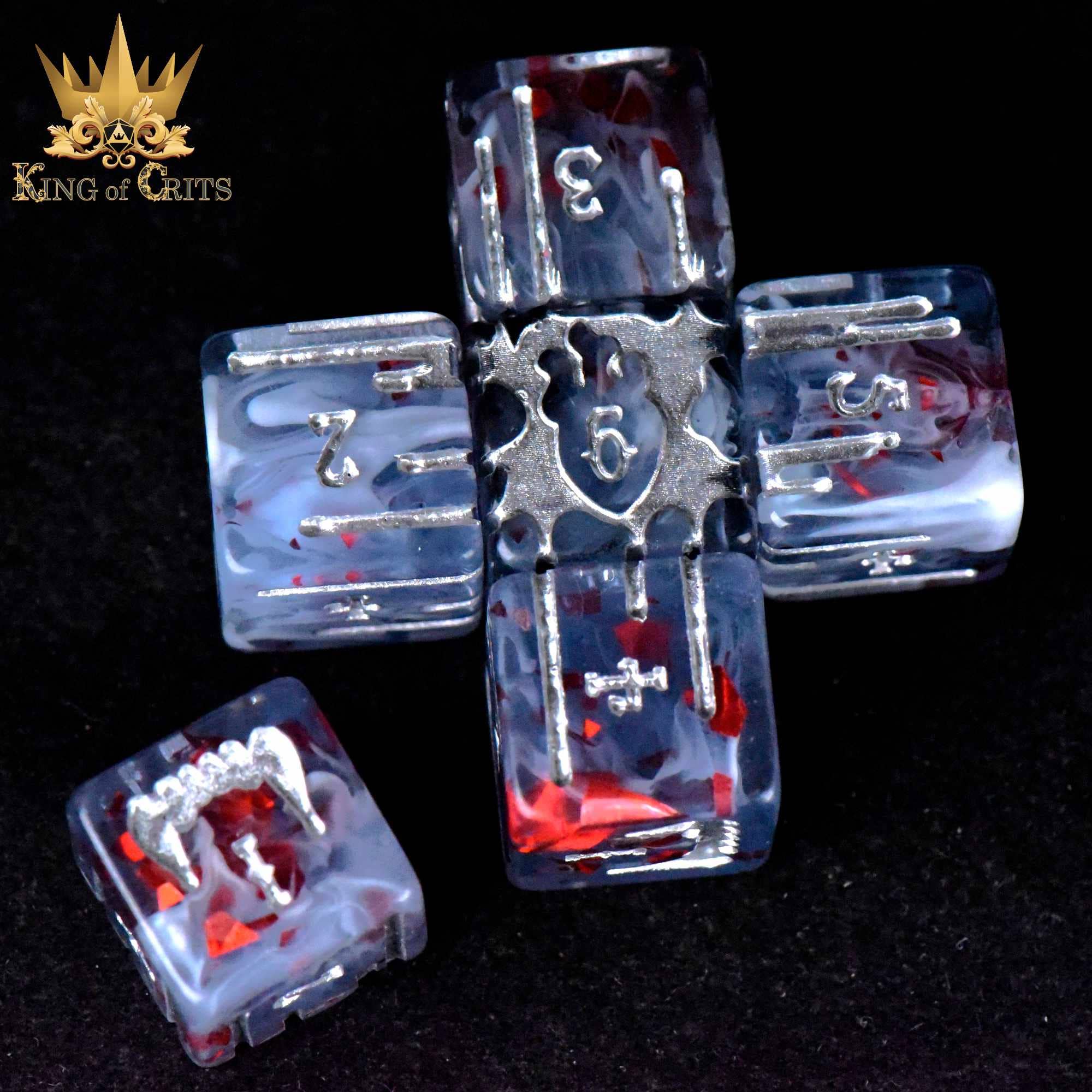Vampiric Bloodline 11 Dice Set with metal and resin dice in a cross shape, gold King of Crits logo.