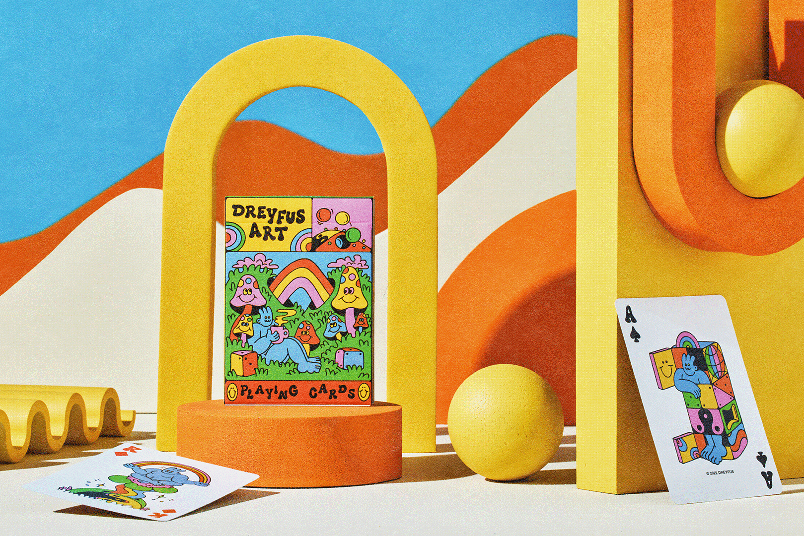 Dreyfus Art Playing Cards with psychedelic designs, shown in a box with two cards displayed.