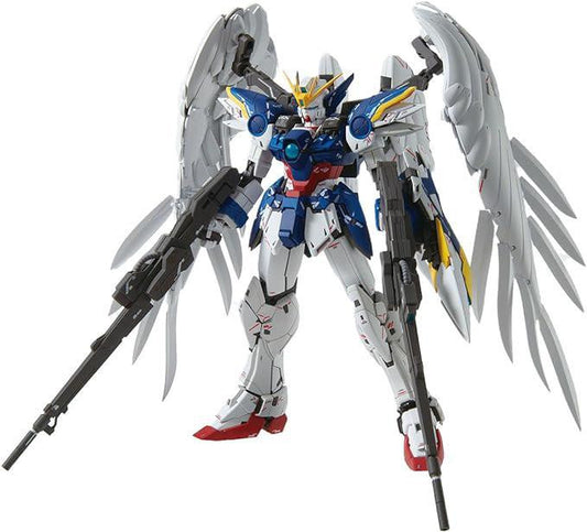 Endless Waltz Wing Gundam Zero (EW) Ver. Ka with white, blue, and red armor, feathered wings, and dual rifles.