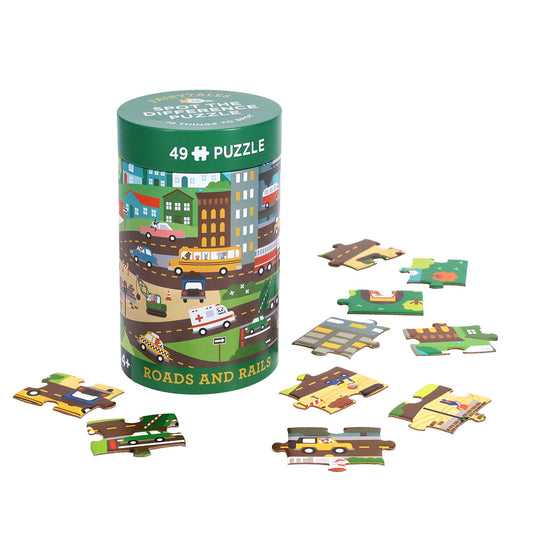 Spot the Difference Puzzle: Roads and Rails in a cylindrical box with colorful pieces.