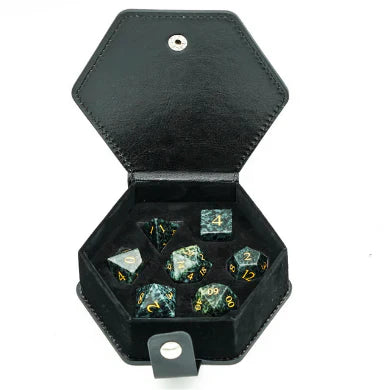 Algal Gemstone RPG dice set with gold numbers by Foam Brain Games in a black hexagonal case.