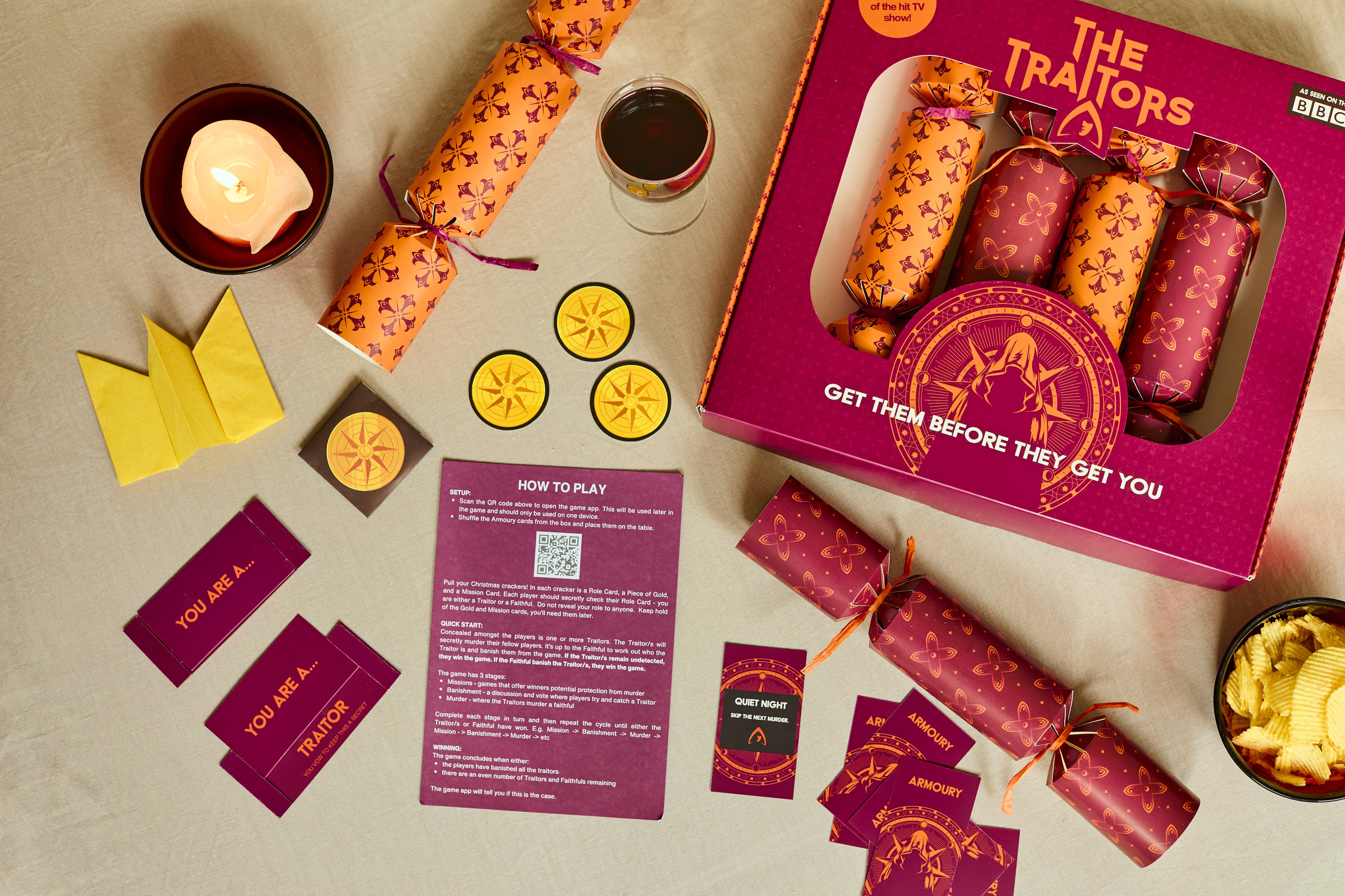 The Traitors Christmas Crackers Set of 6 with cards, coins, candle, and snacks included.