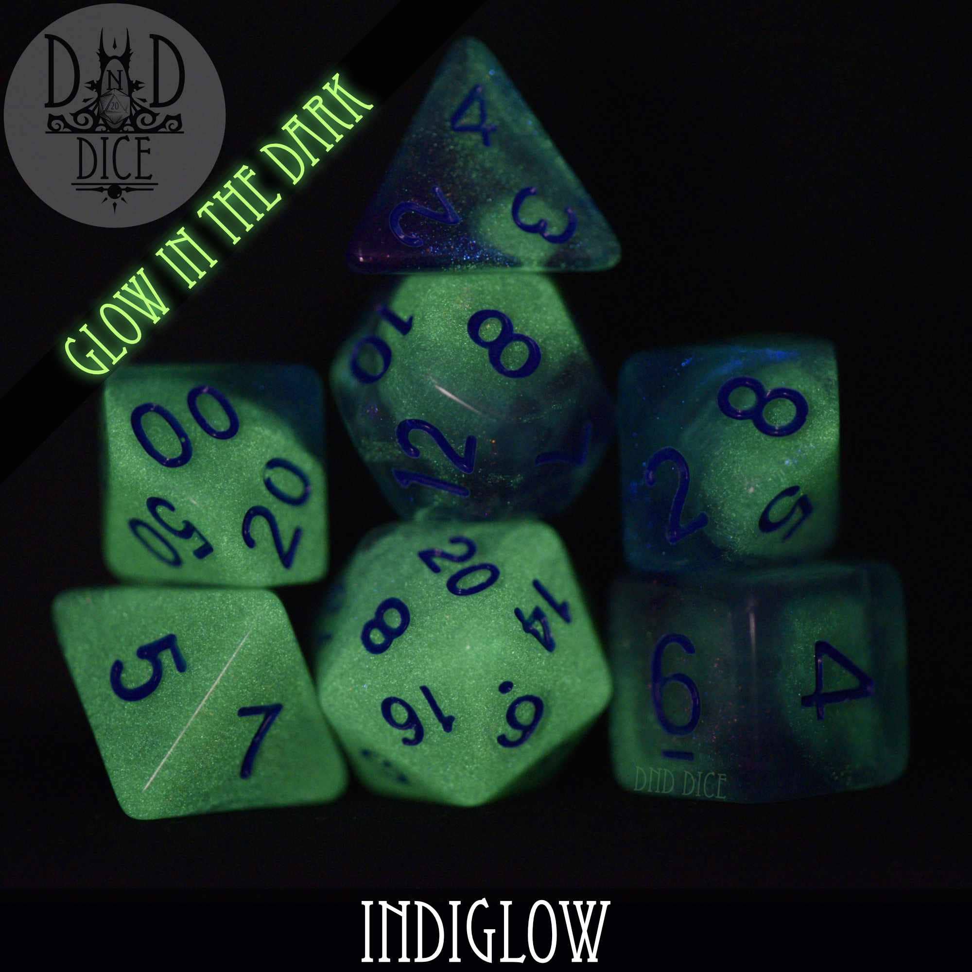 Indiglow Glow in the Dark set of 7 resin DND dice with blue numbers.