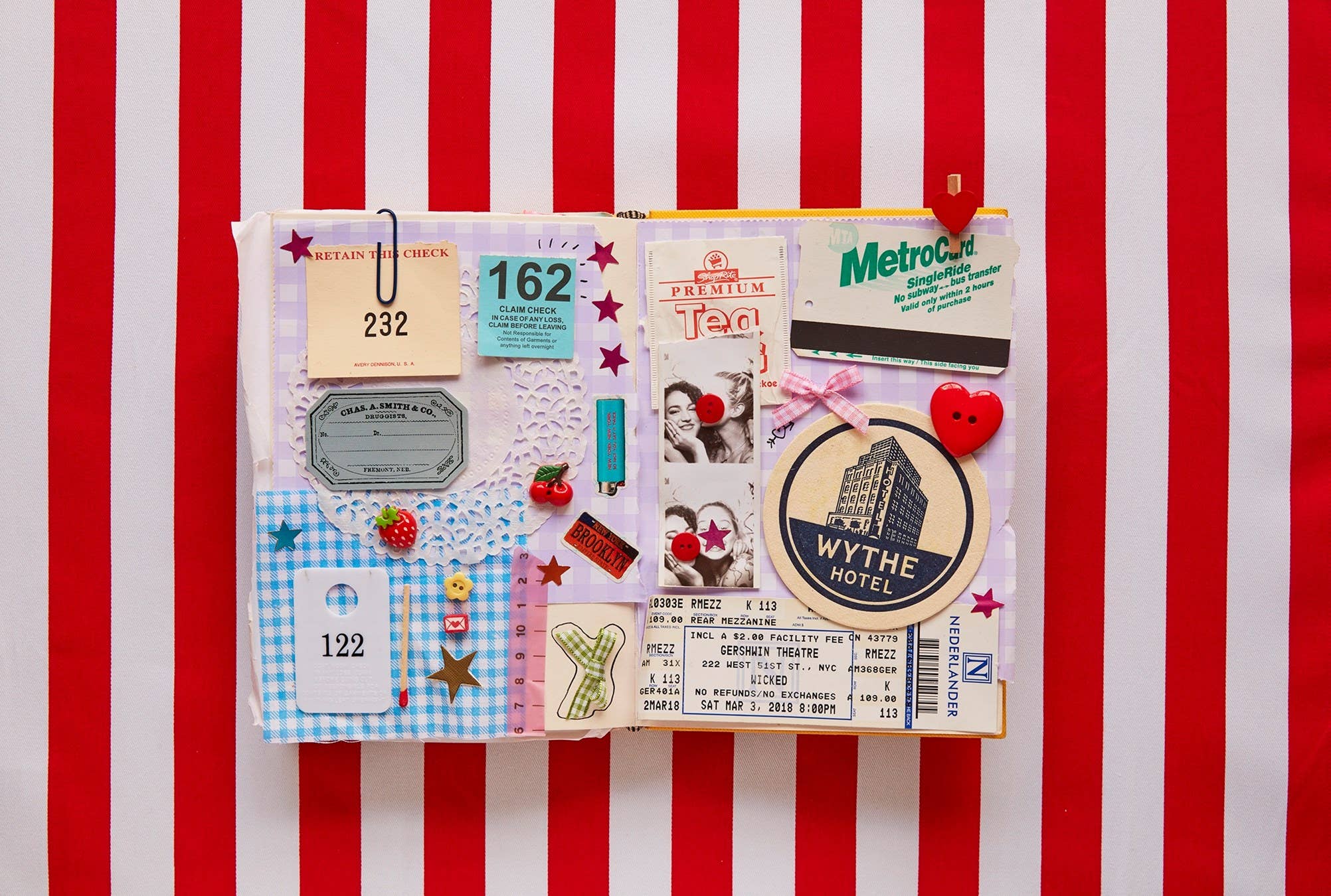 A Year of Junk Journaling book featuring scrapbook ideas using tickets, tags, photos, and buttons on striped backgrounds.